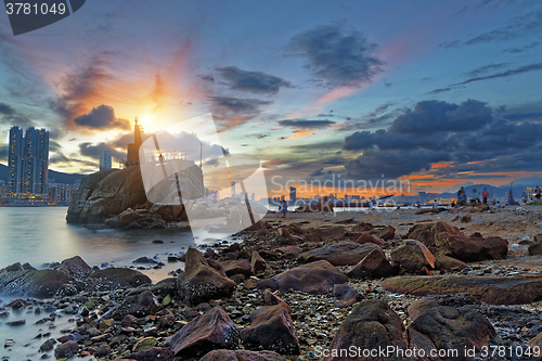 Image of Light House at sea Cove at Sunset