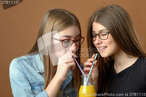 Image of Girls sharing a drink