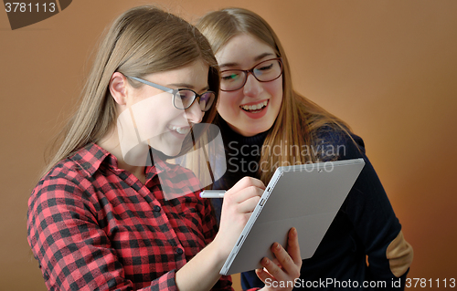 Image of two young teenage girls