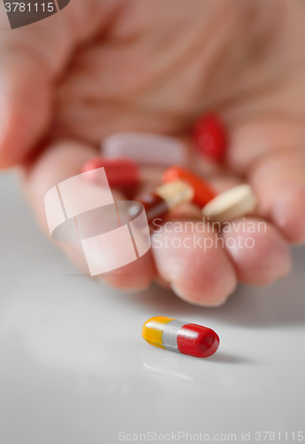 Image of  Hand taking the pill 