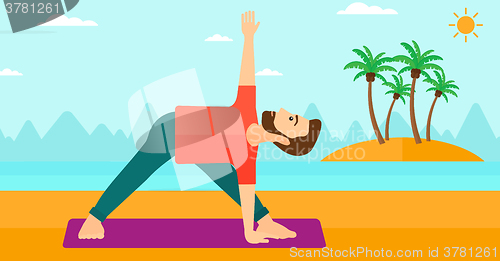 Image of Man practicing yoga.