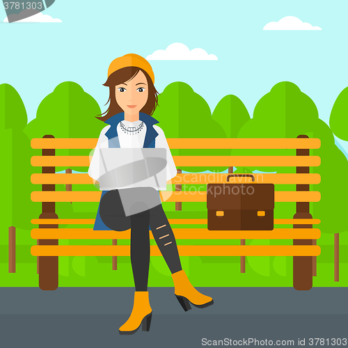 Image of Woman working on laptop.