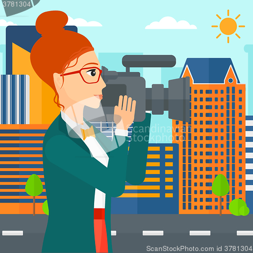 Image of Camerawoman with video camera.