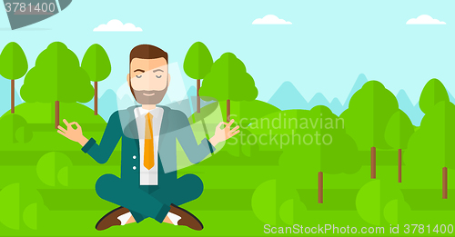 Image of Businessman meditating in lotus pose.