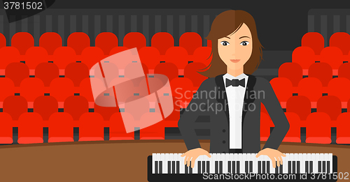 Image of Woman playing piano.