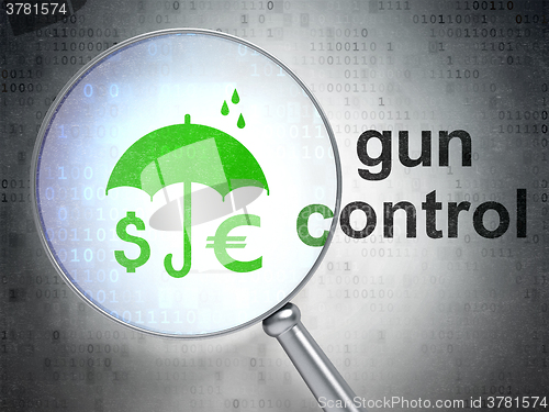 Image of Privacy concept: Money And Umbrella and Gun Control with optical glass