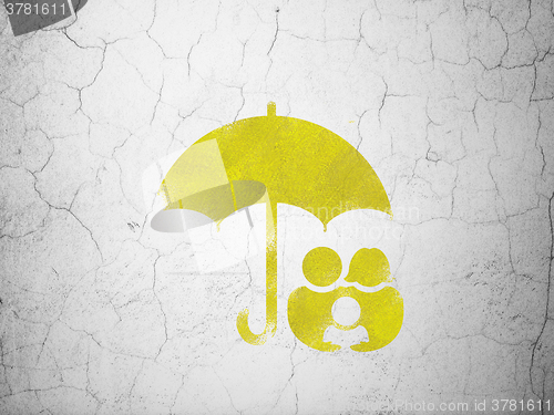 Image of Security concept: Family And Umbrella on wall background