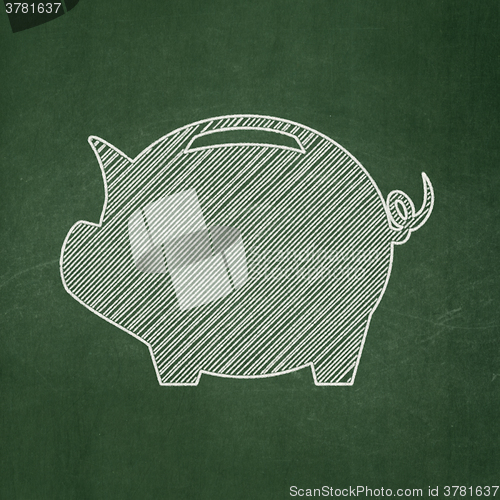 Image of Money concept: Money Box on chalkboard background