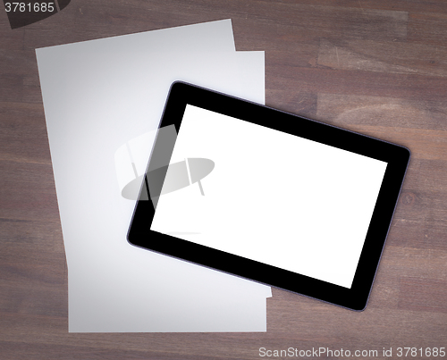 Image of Tablet touch computer gadget on wooden table