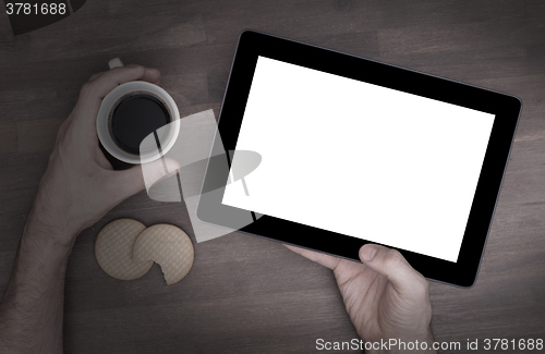 Image of Tablet touch computer gadget on wooden table