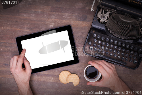 Image of Tablet touch computer gadget on wooden table