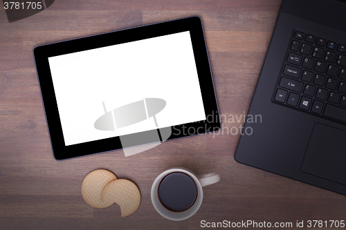 Image of Tablet touch computer gadget on wooden table