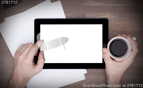 Image of Tablet touch computer gadget on wooden table