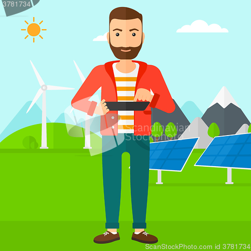 Image of Man using tablet computer.