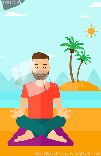 Image of Man meditating in lotus pose.