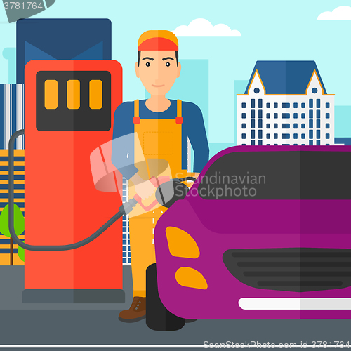 Image of Man filling up fuel into car.