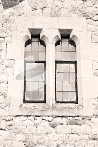 Image of old windon in england london brick and glass the wall 