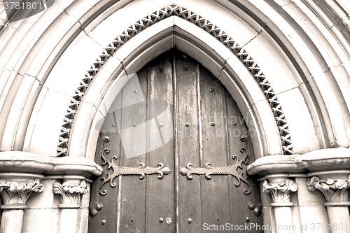Image of brown wooden parliament in london old  door and marble antique  