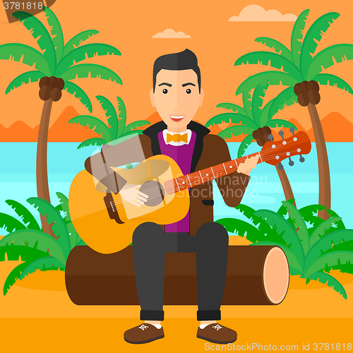 Image of Man playing guitar.