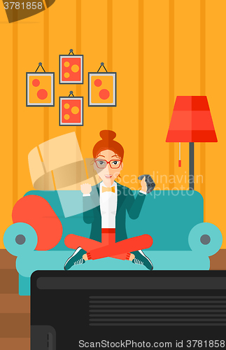 Image of Woman playing video game.