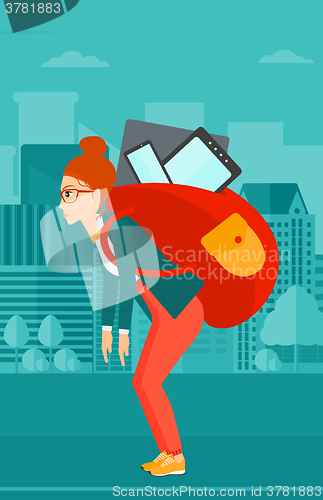 Image of Woman with backpack full of devices.