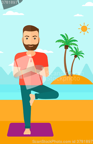 Image of Man practicing yoga.