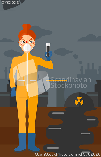 Image of Laboratory assistant with test tube.