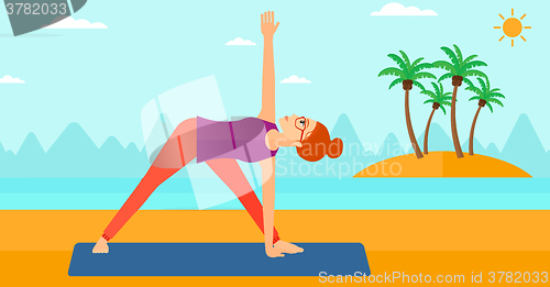 Image of Woman practicing yoga.