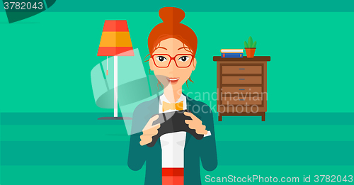 Image of Woman playing video game.