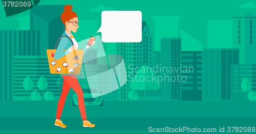 Image of Woman walking with smartphone.