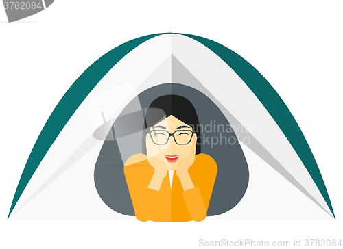 Image of Woman lying in tent.