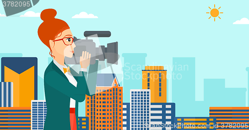 Image of Camerawoman with video camera.