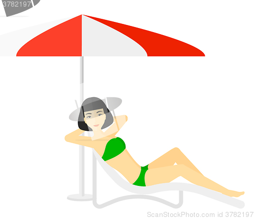 Image of Woman sitting in chaise longue.