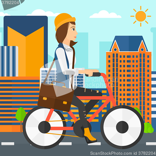 Image of Woman cycling to work.