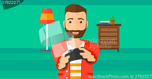 Image of Man playing video game.