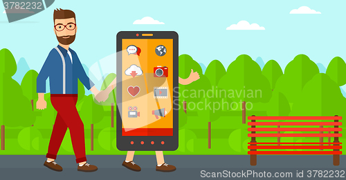 Image of Man walking with smartphone.