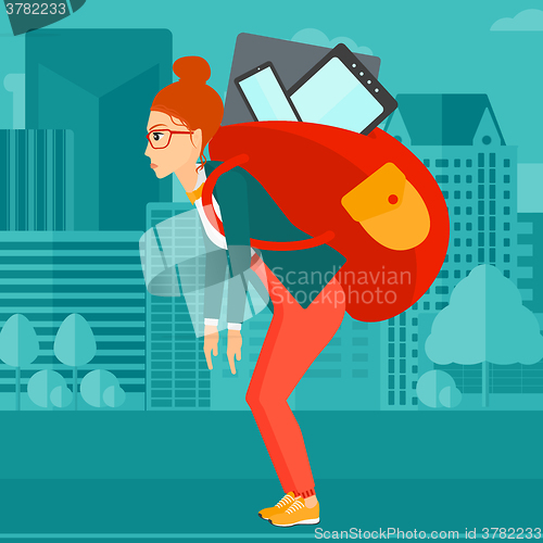 Image of Woman with backpack full of devices.