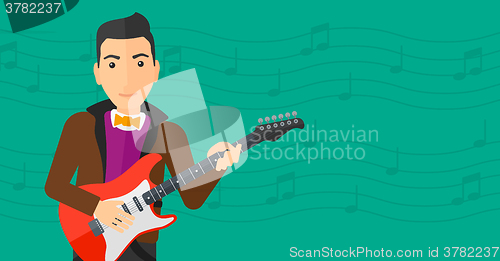 Image of Musician playing electric guitar.