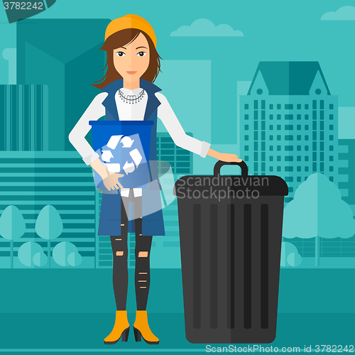 Image of Woman with recycle bins.