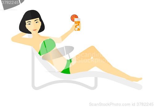 Image of Woman sitting in chaise longue.
