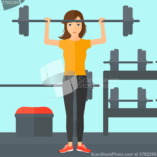 Image of Woman lifting barbell.