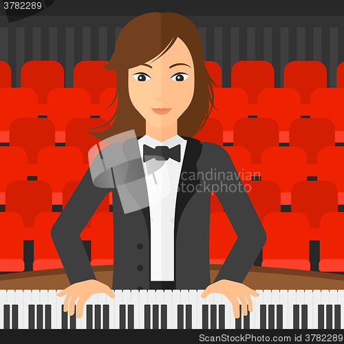 Image of Woman playing piano.