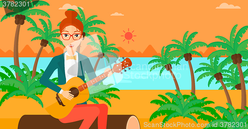 Image of Woman playing guitar.