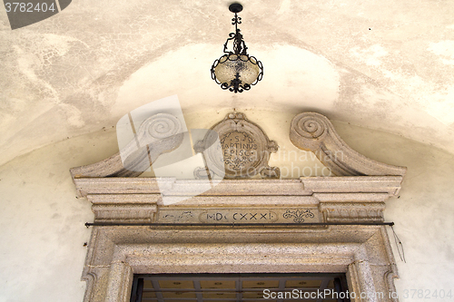 Image of abstract  church door    italy  lombardy   street lamp