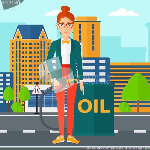 Image of Woman with oil can and filling nozzle.