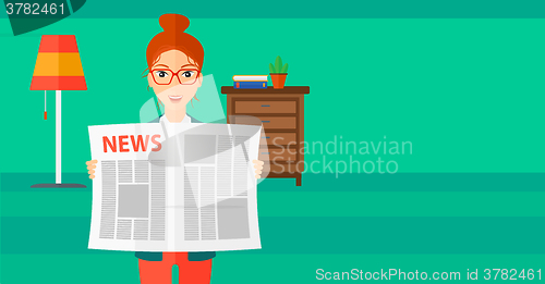 Image of Reporter reading newspaper.