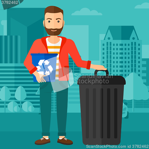 Image of Man with recycle bins.