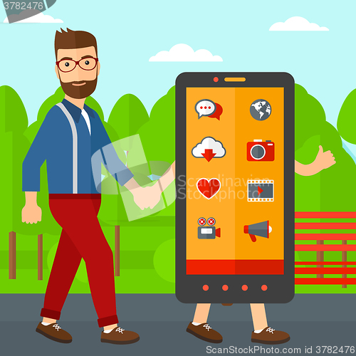 Image of Man walking with smartphone.