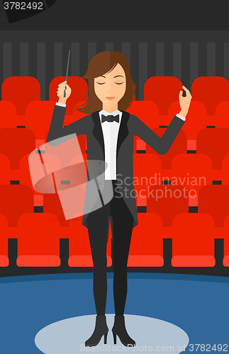 Image of Conductor directing with baton.