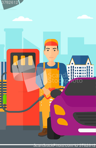 Image of Man filling up fuel into car.